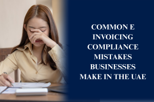 Business professionals reviewing UAE e-invoicing compliance requirements, electronic invoice data, accounting software, and digital tax records.