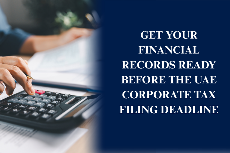 Business professionals preparing financial records, accounting documents, and tax reports for UAE Corporate Tax filing and Federal Tax Authority compliance.